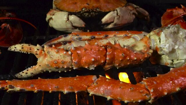 King Crab Legs and Dungeness Crab on the Grill with Butter