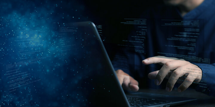 Digital technology, software development concept. Coding programmer, software engineer working on laptop with circuit board and javascript on virtual screen, internet of things IoT
