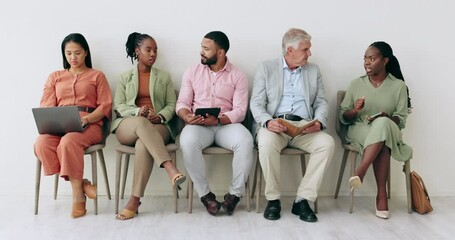 Business people, networking and waiting room in line for recruiting or hiring meeting on chair at office. Diversity or group of candidates sitting in recruitment process, interview or job opportunity
