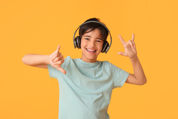 Little boy in headphones showing 
