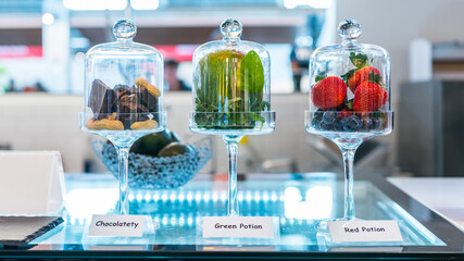Dessert fruit and chocolate glass cups. Selling sweets and treats at the market counter display