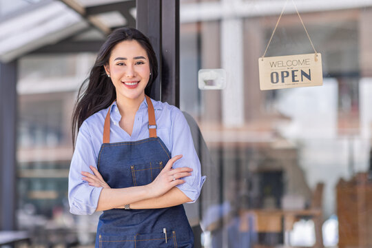 Startup Successful Small Business Owner Sme Beauty Girl Stand With Tablet Smartphone In Coffee Shop Restaurant. Portrait Of Asian Tan Woman Barista Cafe Owner. SME Entrepreneur Seller Business Concept