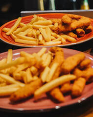 Serving of battered and fried chicken fingers
