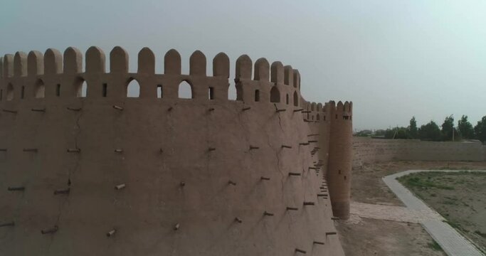 A drone flies along the old wall of a fortress in Bukhara near the Talipach Gate