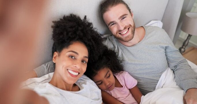 Face, interracial parents and selfie of child in bedroom on video call, profile picture and social media. Family portrait, mom and dad with girl kid for photograph, love and smile at home from above