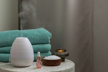 Essential oil aroma diffuser humidifier diffusing water articles in the air. Spa and health care...
