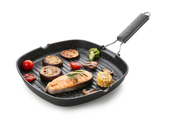 Frying pan with tasty grilled salmon steak and vegetables on white background