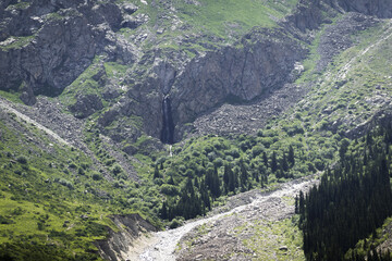 Ala-Archa river valley in a park near Bishkek. Mountain coniferous forests and meadows