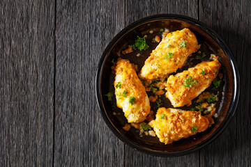 baked chicken breasts under cracker cheese crust