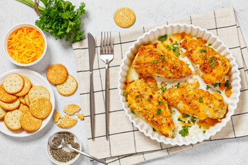 baked chicken breasts under cracker cheese crust