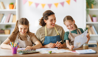 kids and teacher at the art class