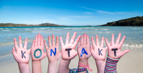 Children Hands Building Word Kontakt Means Contact, Ocean And Sea