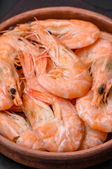 Delicious fresh boiled tiger prawns with salt and spices on a ceramic plate