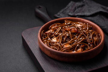 Delicious fresh buckwheat noodles with boiled tiger prawns, salt, spices and mushrooms