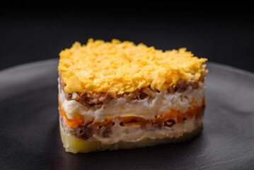 Delicious fresh mimosa salad with canned fish, egg, moinese, cheese, salt and spices