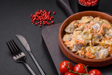 Delicious boiled beef or pork tongue sliced with carrots, onions, sour cream and spices