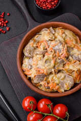 Delicious boiled beef or pork tongue sliced with carrots, onions, sour cream and spices