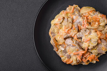 Delicious boiled beef or pork tongue sliced with carrots, onions, sour cream and spices