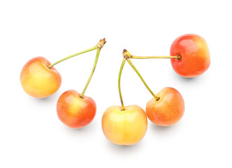 Many sweet yellow cherries on white background