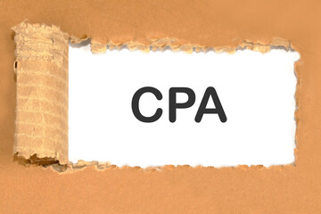 the word CPA is an abbreviation of certified public accountant on white paper through a piece of cardboard
