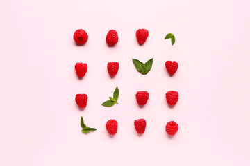 Many fresh raspberries and mint on pink background