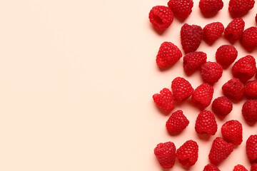 Many fresh raspberries on pink background