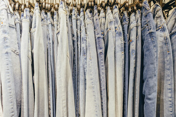 Jeans in the store on a hanger. Closeup.