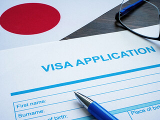 Empty visa application and flag of Japan.