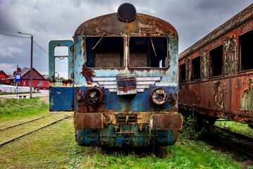 Old rusty electric train abandoned on unused siding