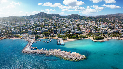Fototapeta na wymiar Aerial view of the town and marina of Varkiza, a popular sea side resort for locals and tourists, Attica, Greece