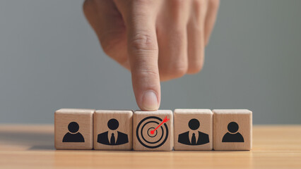 Red dart board and black arrow linked with human icon for customer oriented audience and customer relationship management.