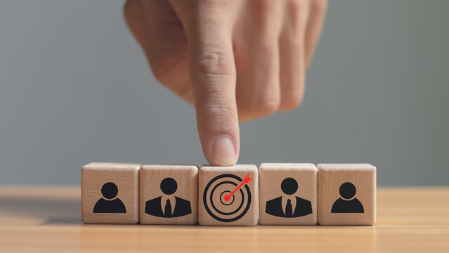 Red dart board and black arrow linked with human icon for customer oriented audience and customer relationship management.