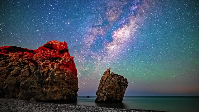 The captivating splendor of the night sky above, resembling an entirely different realm, is beautifully captured in the mesmerizing timelapse footage recorded at the beach in Paphos, Cyprus.