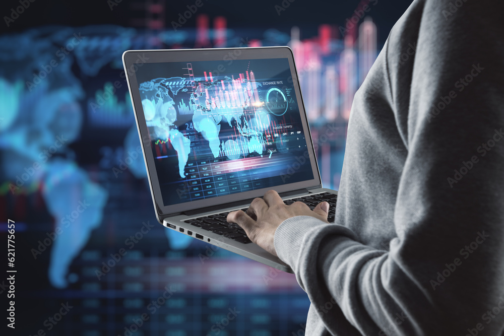 Poster Close up of hacker hands using laptop with creative global forex chart on dark background. Concept of stock market, malware and financial success.