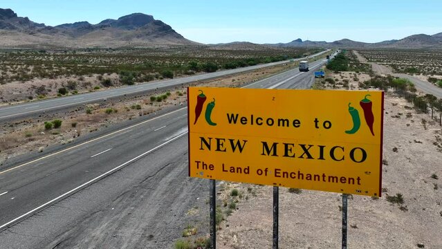 Welcome to New Mexico. The land of enchantment. Rising aerial shot reveal desert landscape in NM.