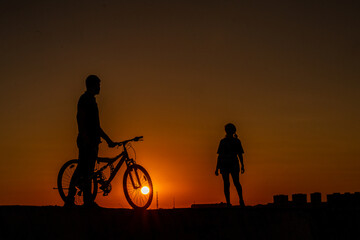 human landscapes traveling at sunset