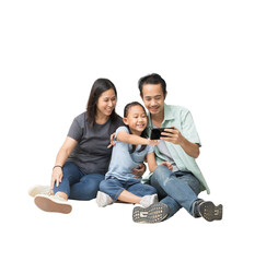 Happy asian family of father, mother and daughter using smart phone on floor, full body isolated on background