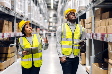 Portrait african american engineer team shipping order detail on tablet export and import,goods,factory,warehouse,international trade,transportation,cargo ship,logistic,distribution.business industry