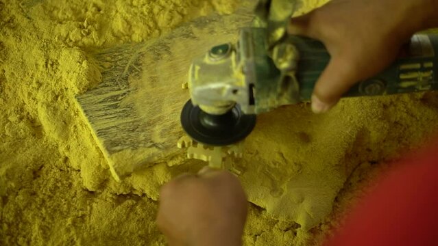 Professional artisans are making traditional Javanese wooden dolls called wayang. The initial process of making this traditional puppet was made from whole wood which was cut and smoothed