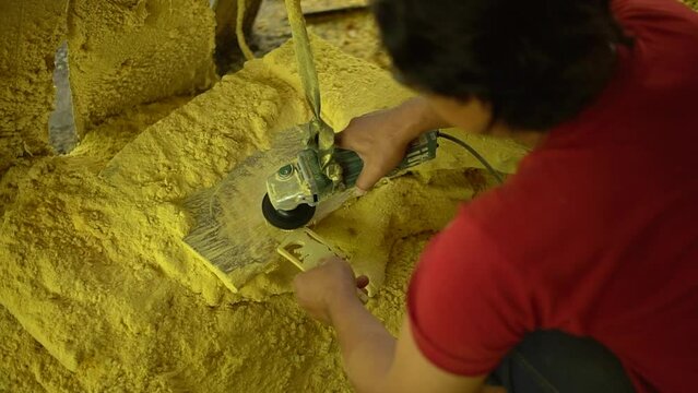 Professional artisans are making traditional Javanese wooden dolls called wayang. The initial process of making this traditional puppet was made from whole wood which was cut and smoothed