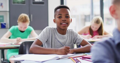 Diverse female teacher and happy schoolchildren having science class in school lab - Powered by Adobe