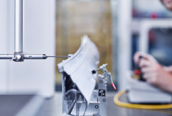 Happy businesswoman using mobile phone and sitting with credit card