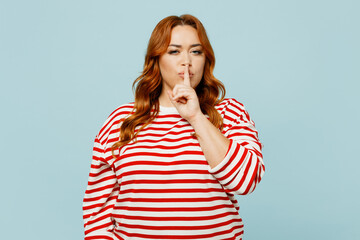 Young secret chubby overweight woman she wearing striped red shirt casual clothes saying hush be...