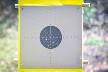 Hole in the gun shooting training target from shooter shooter.
