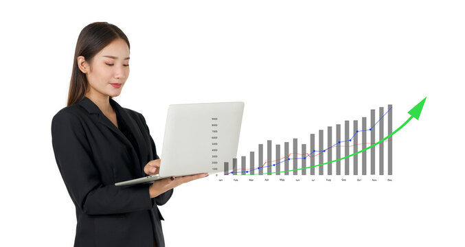Businesswoman in black suit analyzing forex trading graph financial data on laptop computer. 2023 business finance technology and investment concept. Stock market investments funds and digital assets.