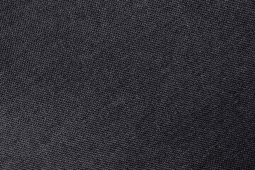 Fototapeta na wymiar Black grey fabric cloth texture for background, natural textile pattern.