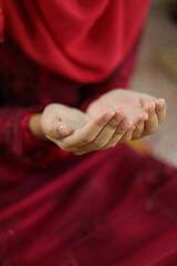 Hands of a Muslim girl praying for a blessing from God. Success and forgiveness, spirituality, faith, worship, action, and prayer.
