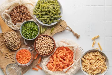 Fotobehang A variety of fusilli pasta from different types of legumes. Gluten-free pasta. © Olena Rudo