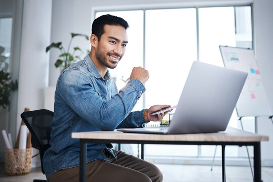 Thinking, laptop and happy man at desk reading email, online report or research planning at design agency. Business, brainstorming and computer, employee in creative office with internet and smile.