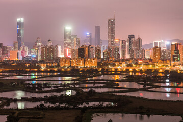 view of Shenzhen with fish pond in foreground at northern hong kong 